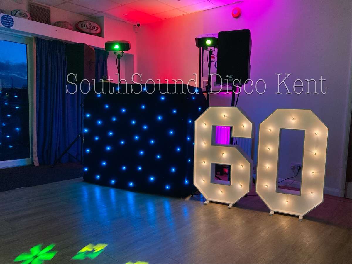 SouthSound Disco Setup for a birthday party in Kent. A vibrant party room with a DJ and dazzling disco lights.